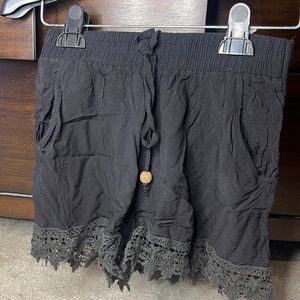 Black crochet style shorts in a size small